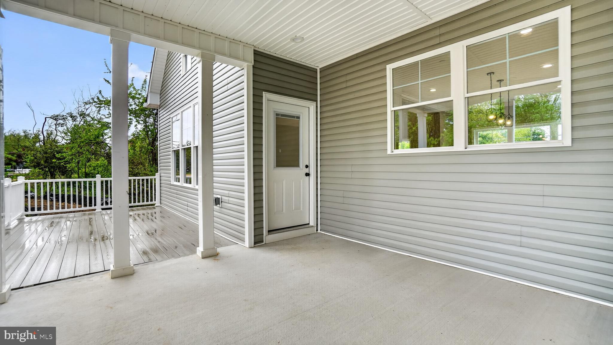 2001 Poplar Ridge Road Pasadena, MD 21122 - Photo 57 of 83 a view of a porch with a door and wooden floor