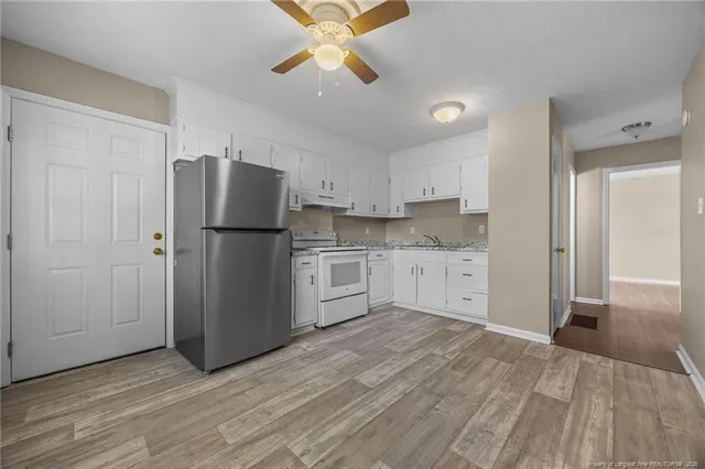 a kitchen with a refrigerator a sink and dishwasher