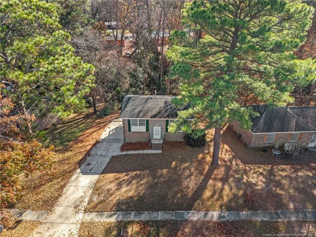 a view of a backyard with sitting area