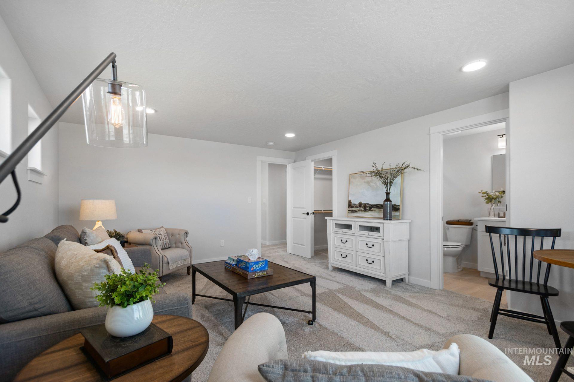 802 Coral Road Kimberly, ID 83341 - Photo 12 of 29 Living area with light carpet and recessed lighting