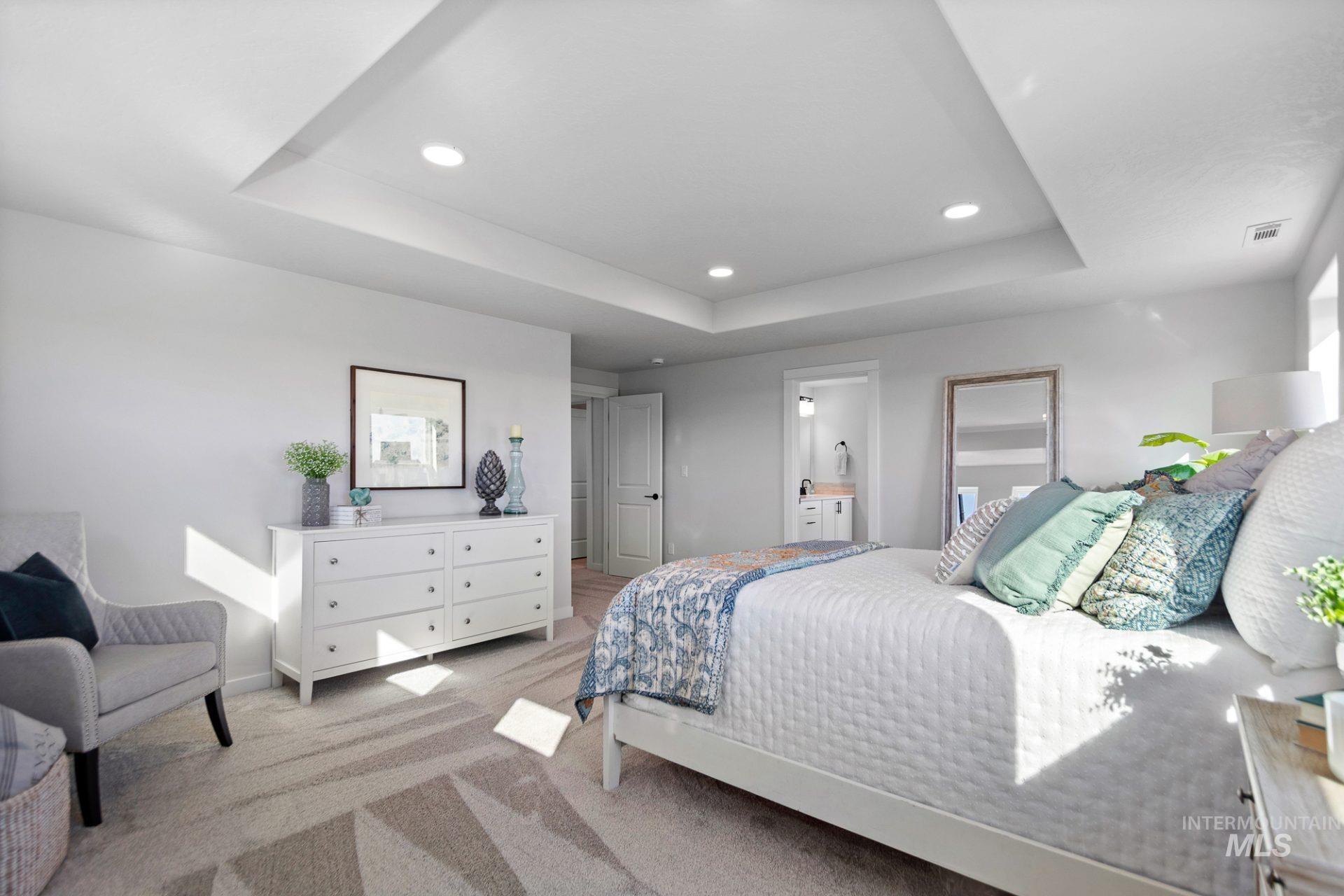 802 Coral Road Kimberly, ID 83341 - Photo 20 of 29 Carpeted bedroom with a raised ceiling, recessed lighting, and connected bathroom