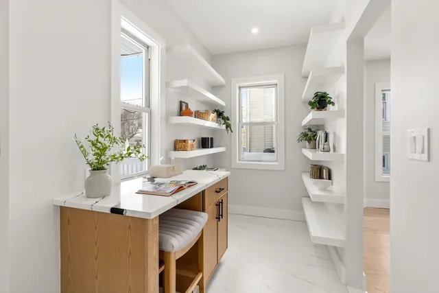 a workspace with furniture and window