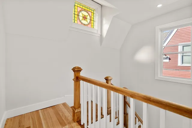 a view of a hallway with a window
