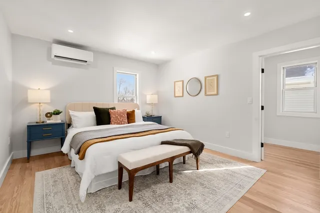 a bedroom with a bed and a table