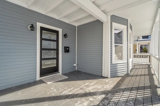 a view of a house with a door and a window