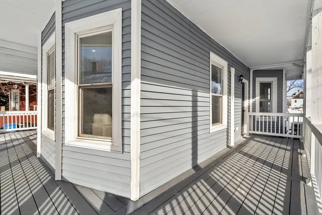 a view of a balcony with wooden floor