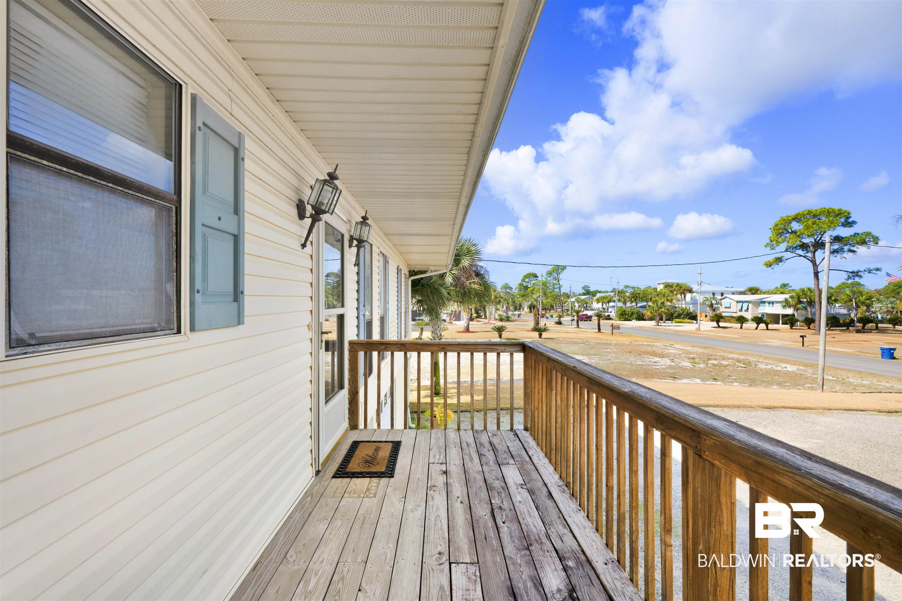 26222 Marina Road Orange Beach, AL 36561 - Photo 14 of 38 Wooden porch featuring a residential view