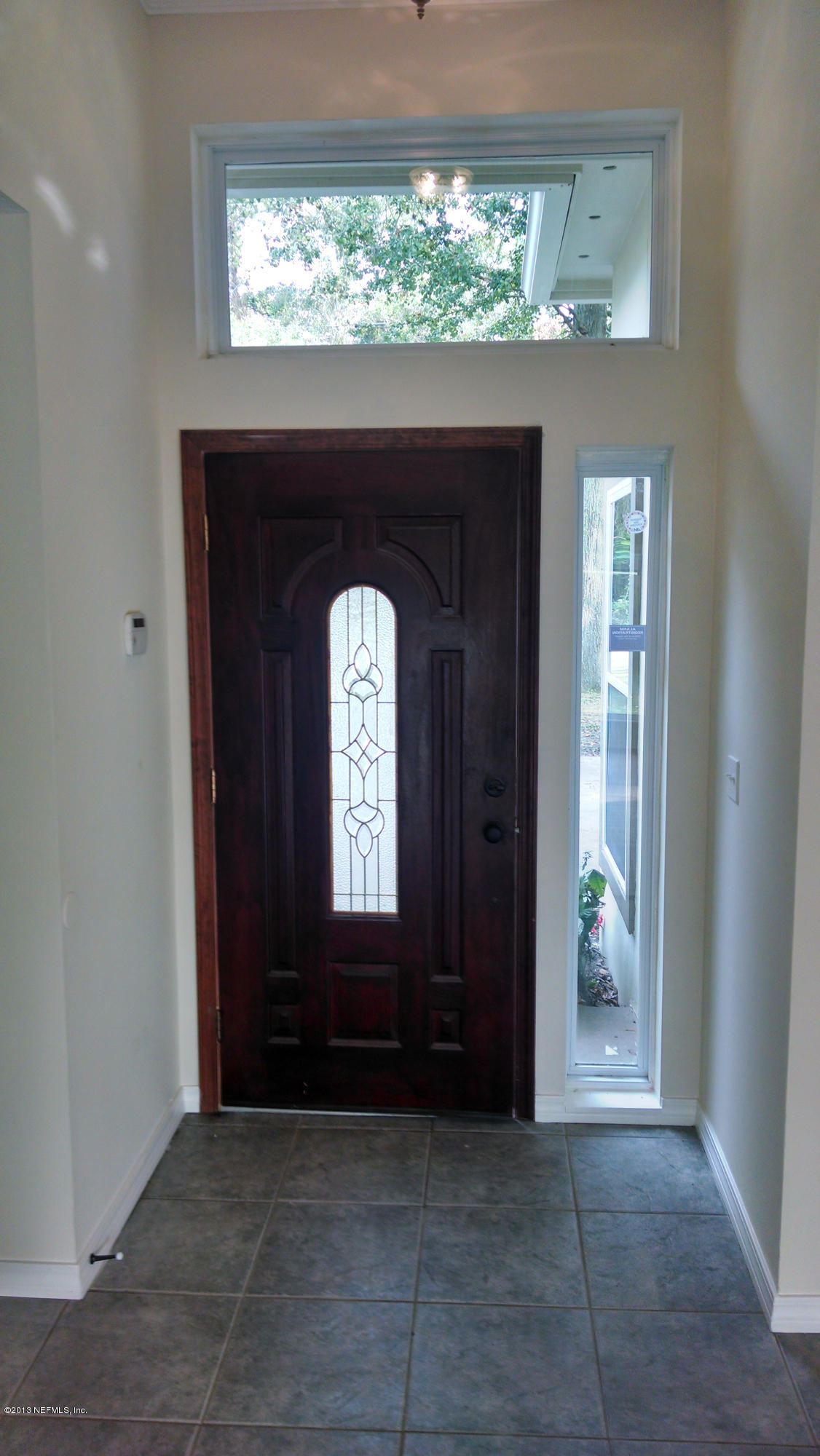 7030 St Augustine Road Jacksonville, FL 32217 - Photo 3 of 12 an empty room that has a window