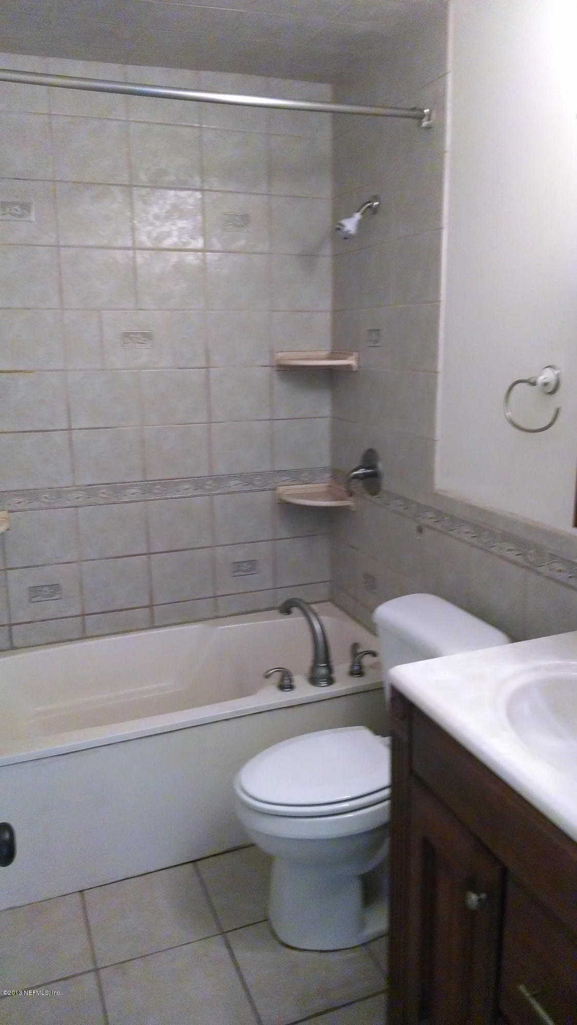 7030 St Augustine Road Jacksonville, FL 32217 - Photo 10 of 12 a bathroom with a sink a toilet and bathtub