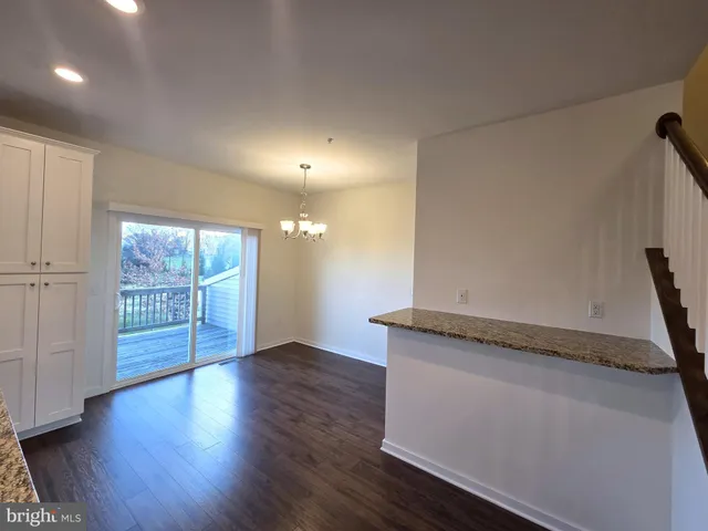 a view of a livingroom with wooden floor