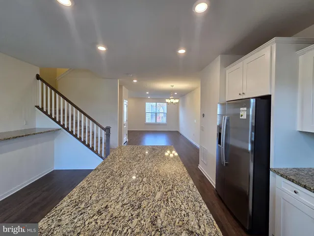 a view of hallway with wooden floor