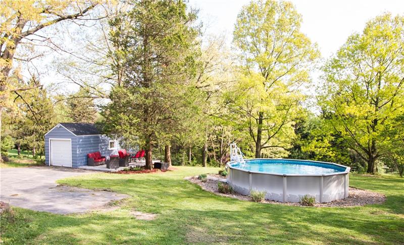 141 Oakville Road Beaver Falls, PA 15010 - Photo 23 of 24 Exterior garage, concrete patio and pool