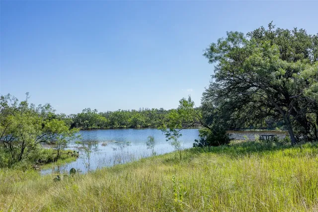 a view of lake with green space