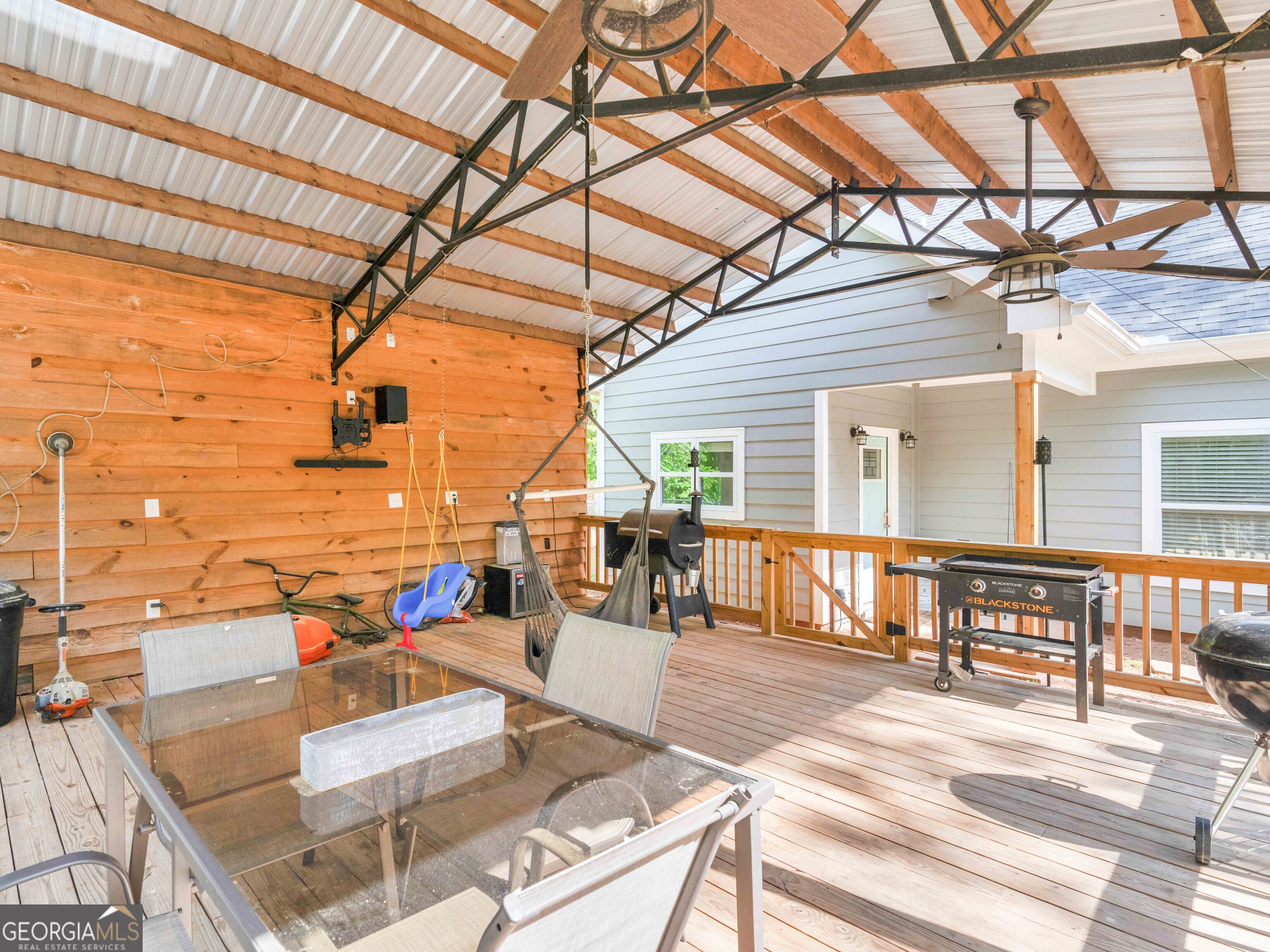180 Preservation Avenue Jackson, GA 30233 - Photo 23 of 27 a view of a patio with couches chairs and potted plants