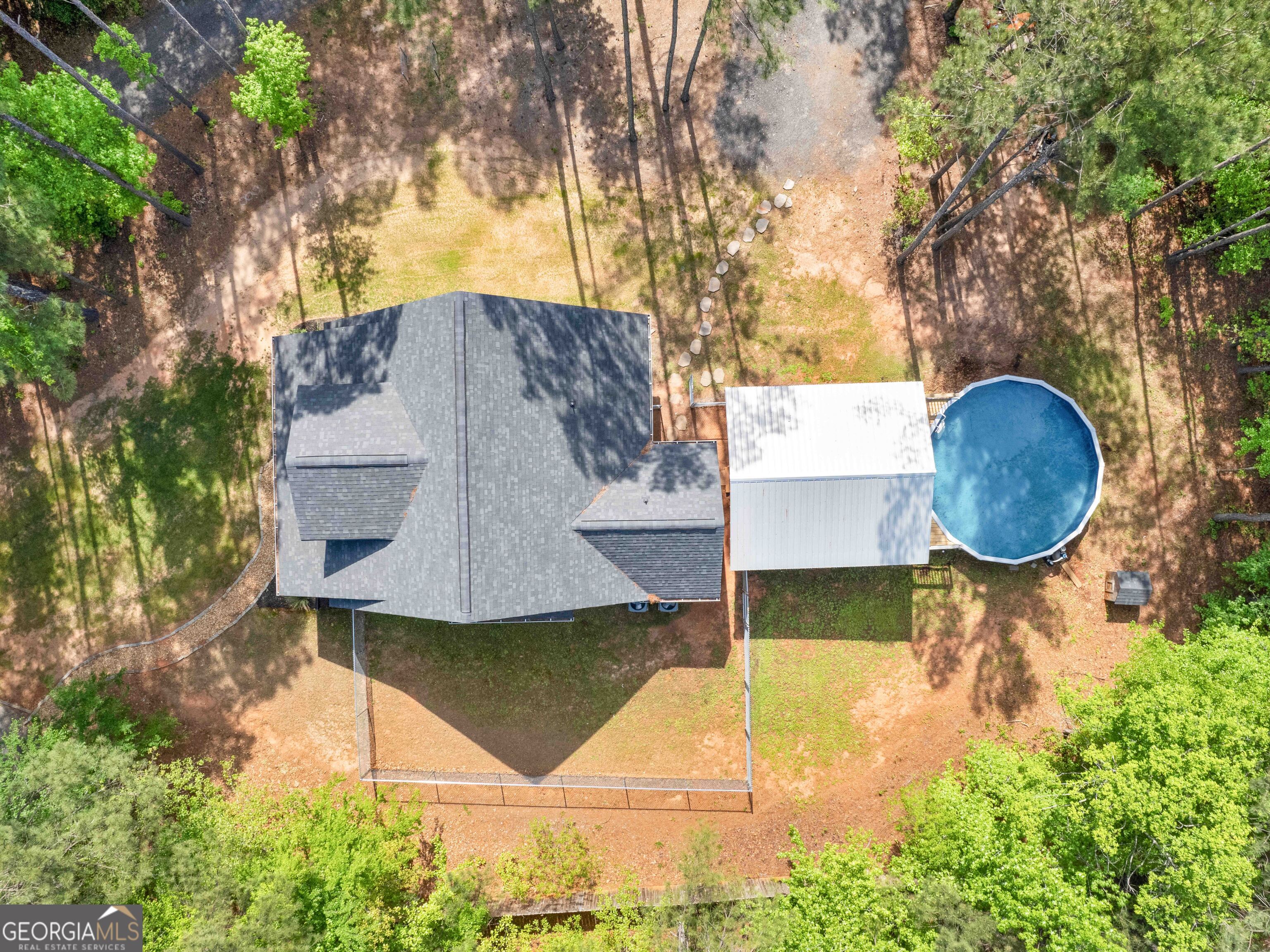 180 Preservation Avenue Jackson, GA 30233 - Photo 27 of 27 a aerial view of a house with swimming pool and large trees