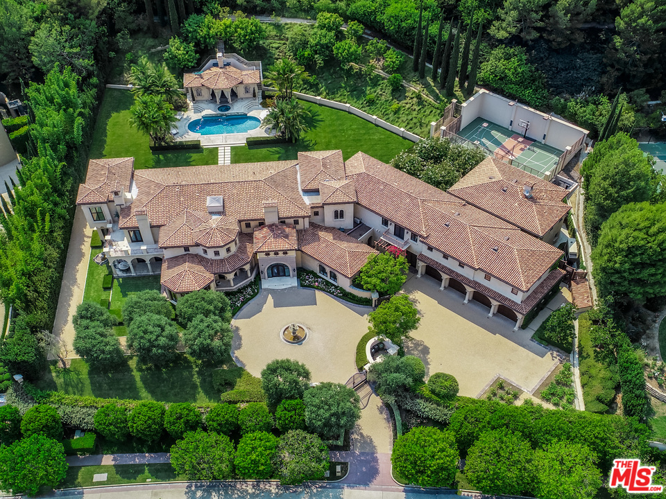 an aerial view of a house with outdoor space and street view