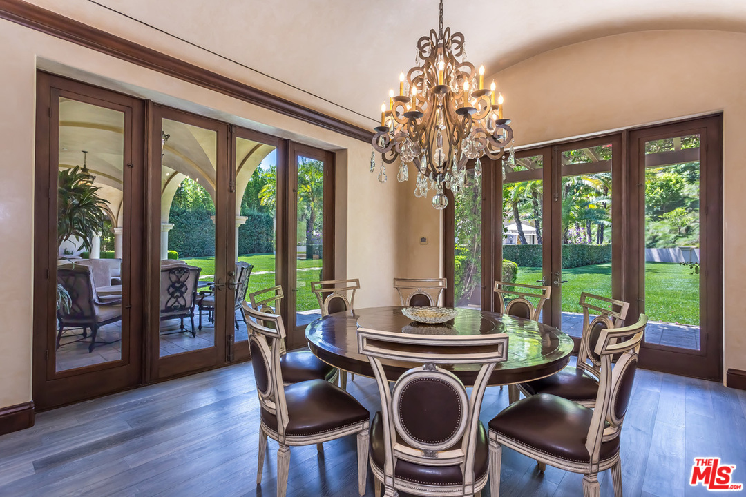 44 Beverly Park Circle Beverly Hills, CA 90210 - Photo 13 of 52 a view of a dining room with furniture large windows and wooden floor