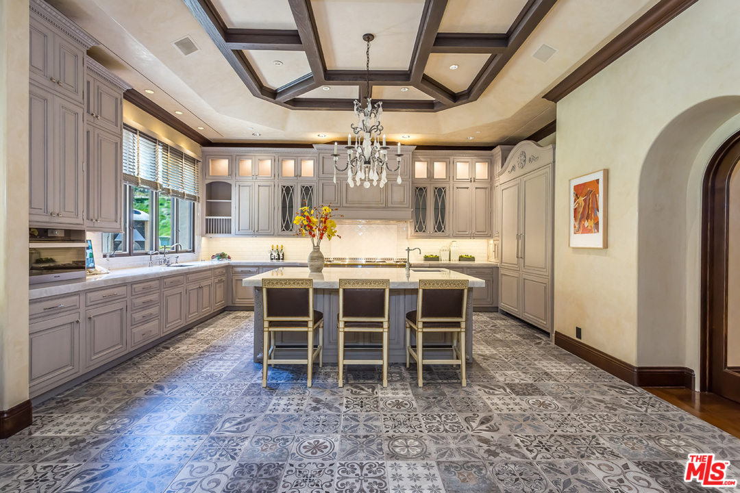 44 Beverly Park Circle Beverly Hills, CA 90210 - Photo 15 of 52 a large white kitchen with a large window