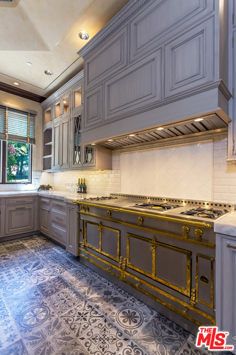 44 Beverly Park Circle Beverly Hills, CA 90210 - Photo 17 of 52 a kitchen with stainless steel appliances granite countertop a sink and cabinets