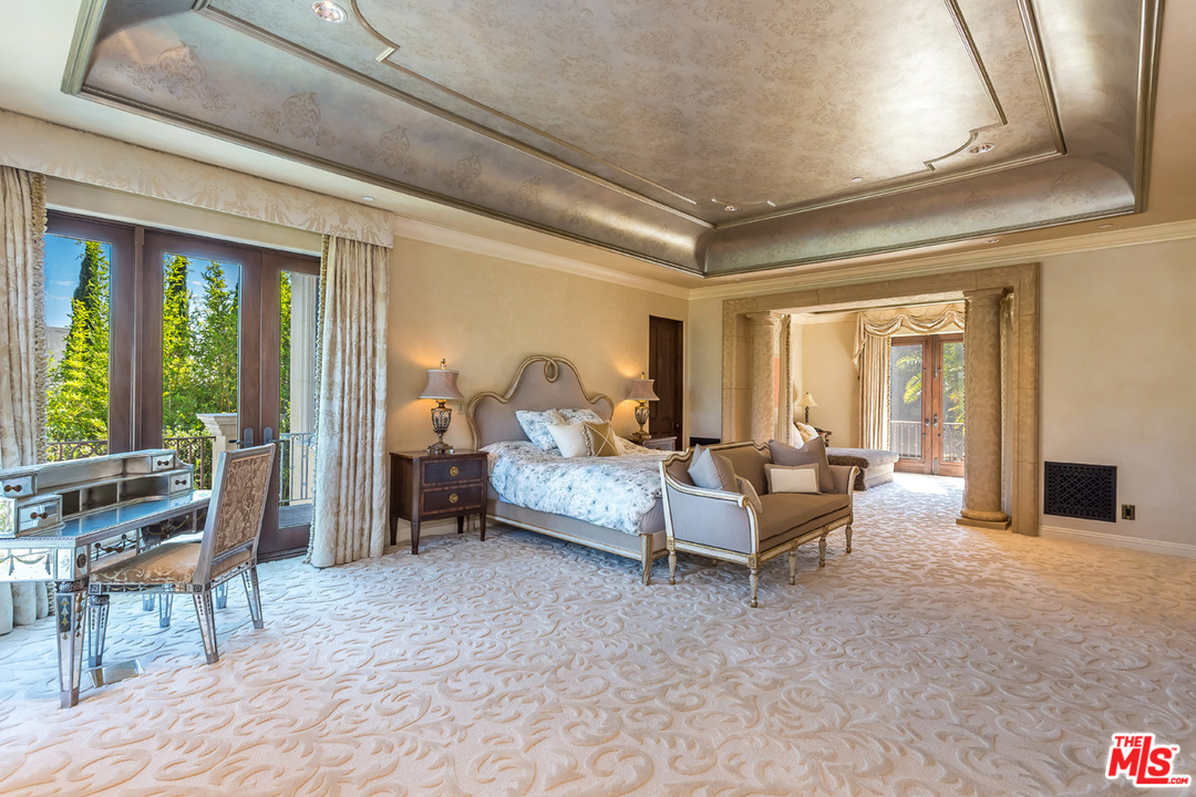 44 Beverly Park Circle Beverly Hills, CA 90210 - Photo 22 of 52 a living room with furniture and large windows