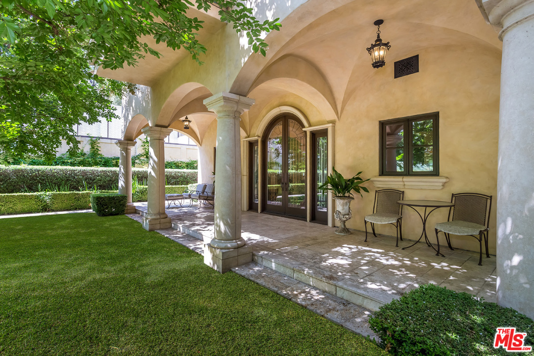 44 Beverly Park Circle Beverly Hills, CA 90210 - Photo 38 of 52 a view of a house with a backyard and porch