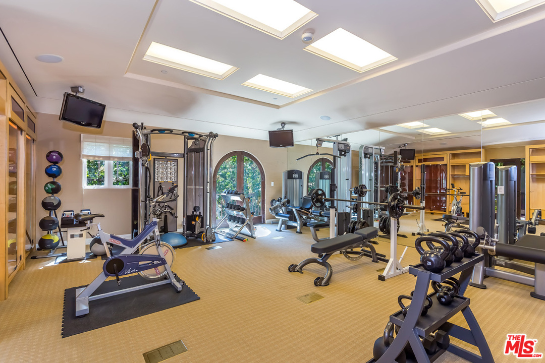 44 Beverly Park Circle Beverly Hills, CA 90210 - Photo 49 of 52 a view of a room with gym equipment