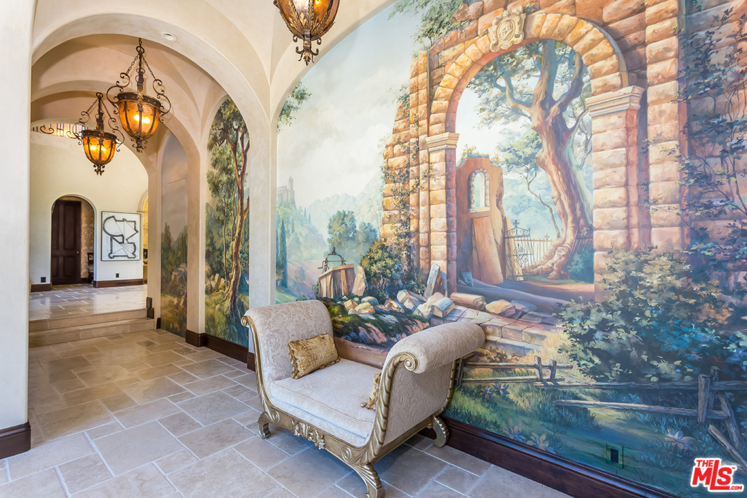 44 Beverly Park Circle Beverly Hills, CA 90210 - Photo 6 of 52 a living room with furniture and a floor to ceiling window