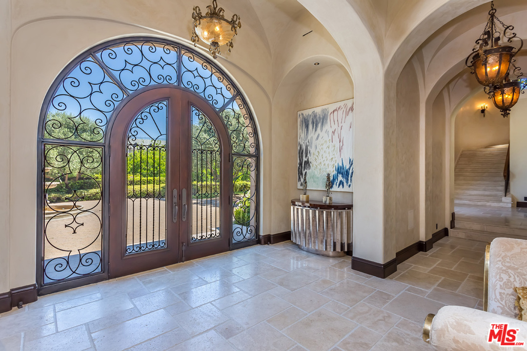 44 Beverly Park Circle Beverly Hills, CA 90210 - Photo 8 of 52 a view of an entryway with a chandelier
