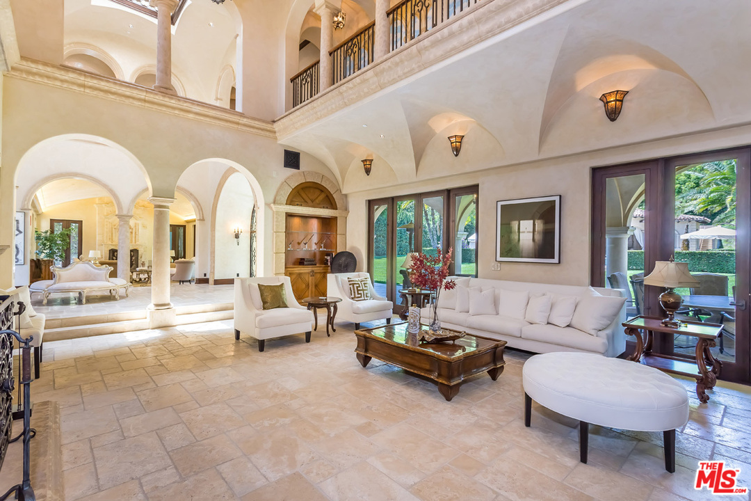 44 Beverly Park Circle Beverly Hills, CA 90210 - Photo 10 of 52 a living room with furniture and a large window