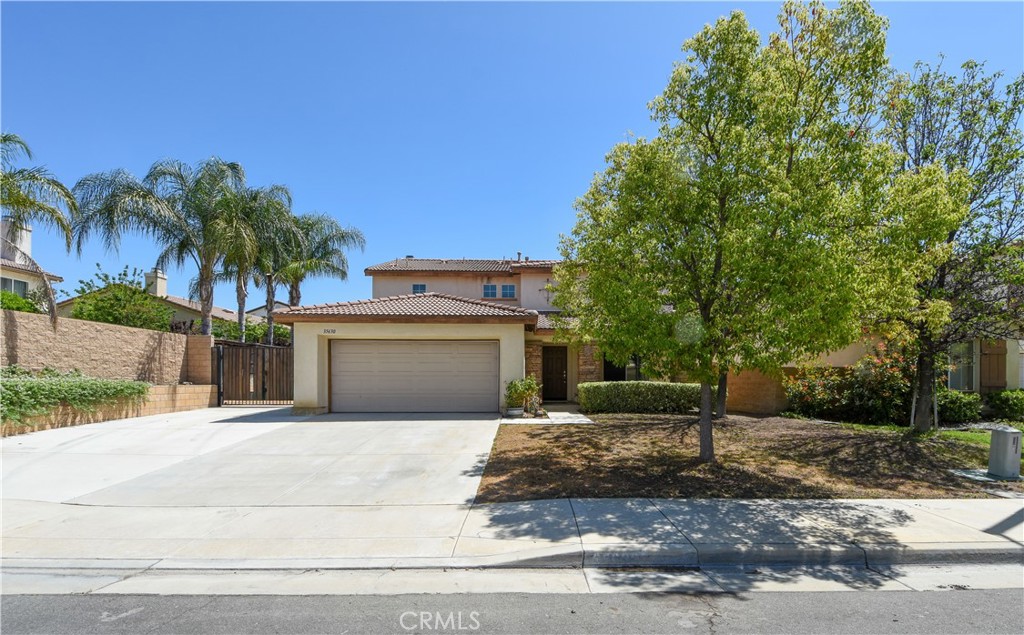 35630 Bryce Road Winchester, CA 92596 - Photo 2 of 32 a front view of a house with a yard and garage