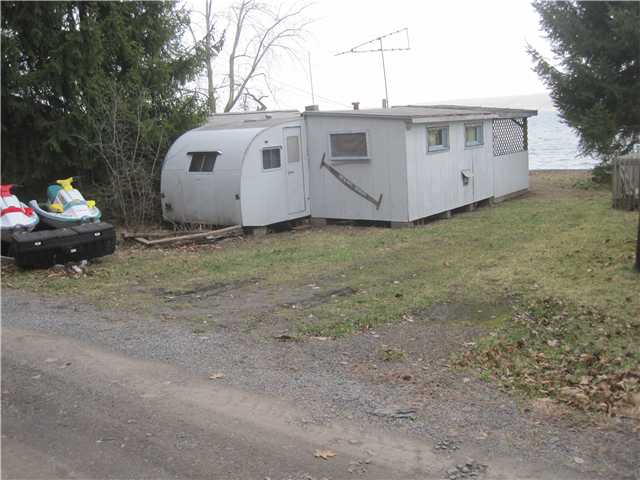 4194 Upson Point Road Starkey, NY 14837 - Photo 1 of 1 Exterior Front existing camper with addition - fun
