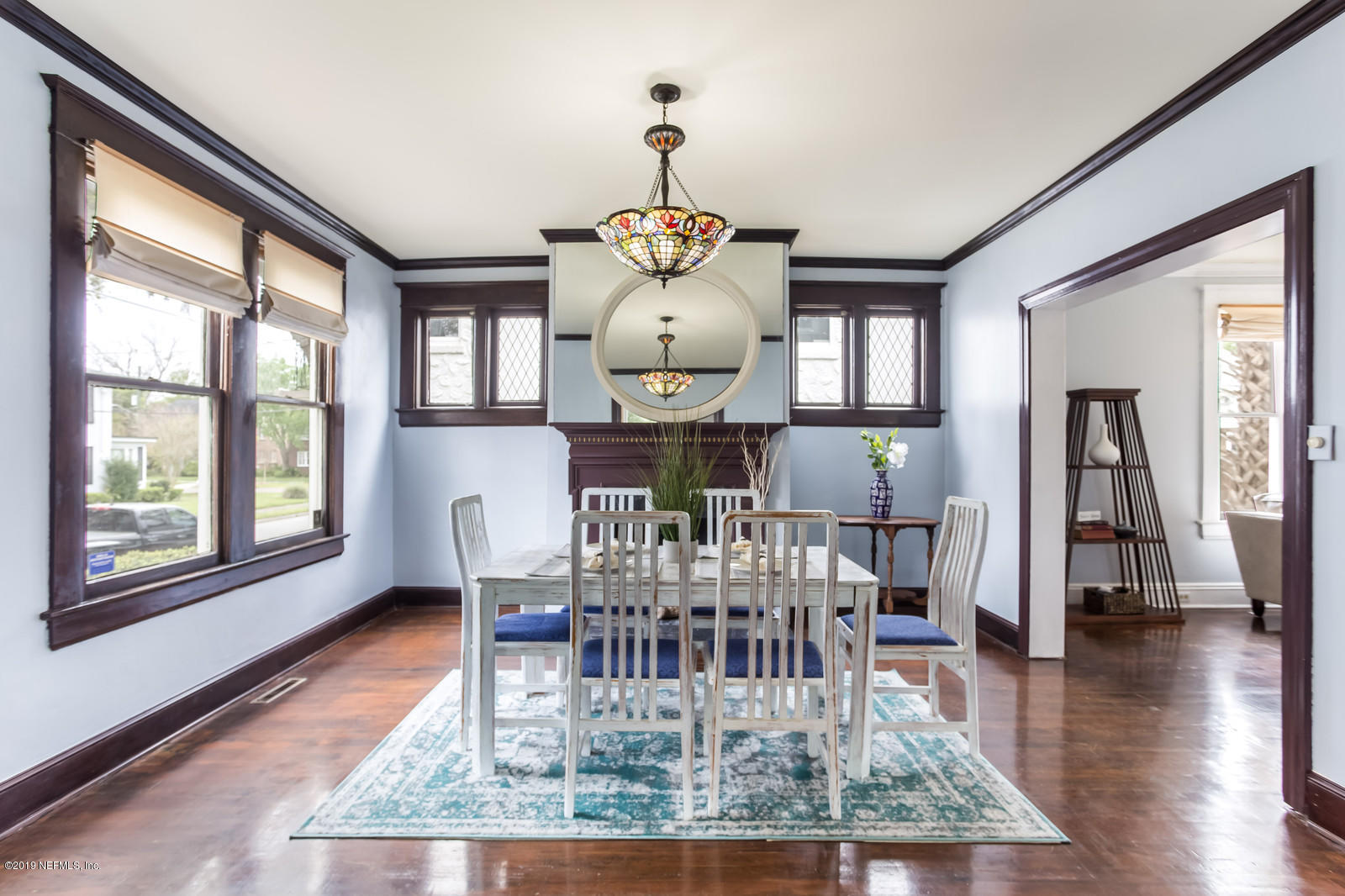 1620 Cherry Street Jacksonville, FL 32205 - Photo 11 of 34 a dining room with wooden floor a chandelier a wooden table and chairs