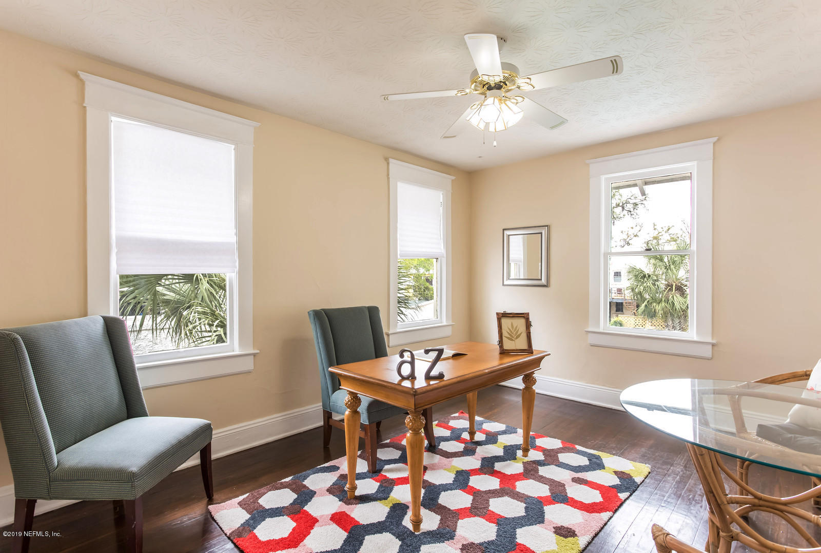1620 Cherry Street Jacksonville, FL 32205 - Photo 30 of 34 a dining room with wooden floor and a chandelier