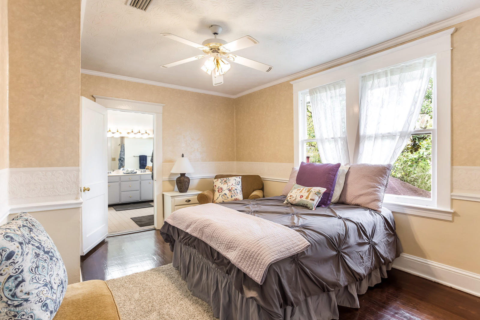 1620 Cherry Street Jacksonville, FL 32205 - Photo 31 of 34 a bedroom with a bed and wooden floor