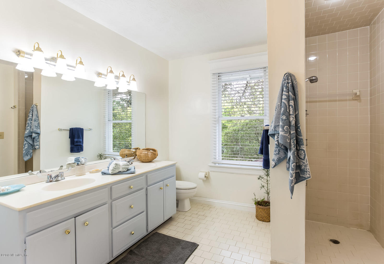 1620 Cherry Street Jacksonville, FL 32205 - Photo 32 of 34 a bathroom with a double vanity sink mirror and shower