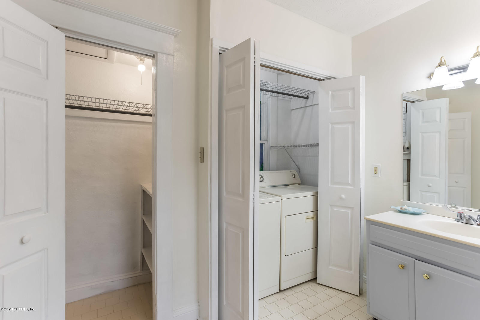 1620 Cherry Street Jacksonville, FL 32205 - Photo 33 of 34 a bathroom with a shower sink and mirror