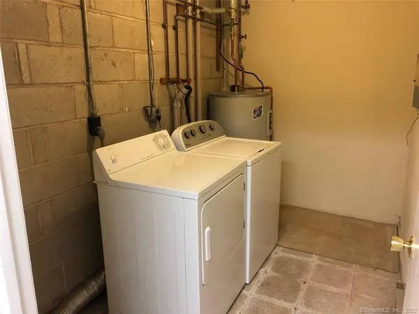 a utility room with dryer and washer