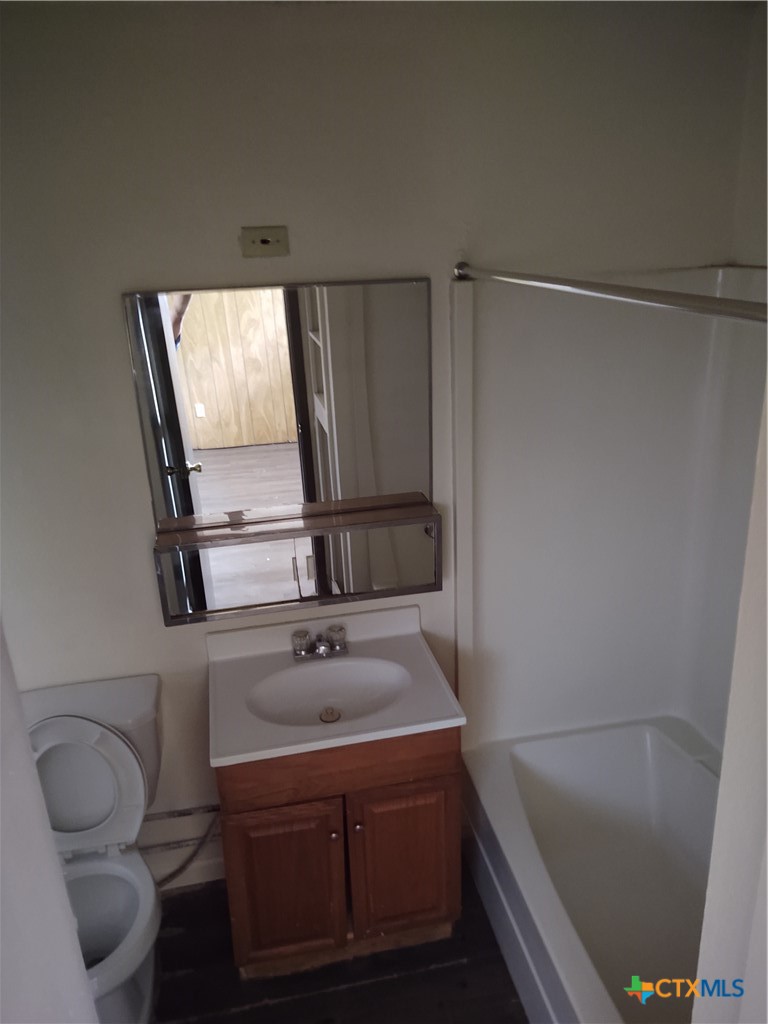 200-220 Quail Run Road Martindale, TX 78655 - Photo 2 of 16 a bathroom with a sink a toilet and shower
