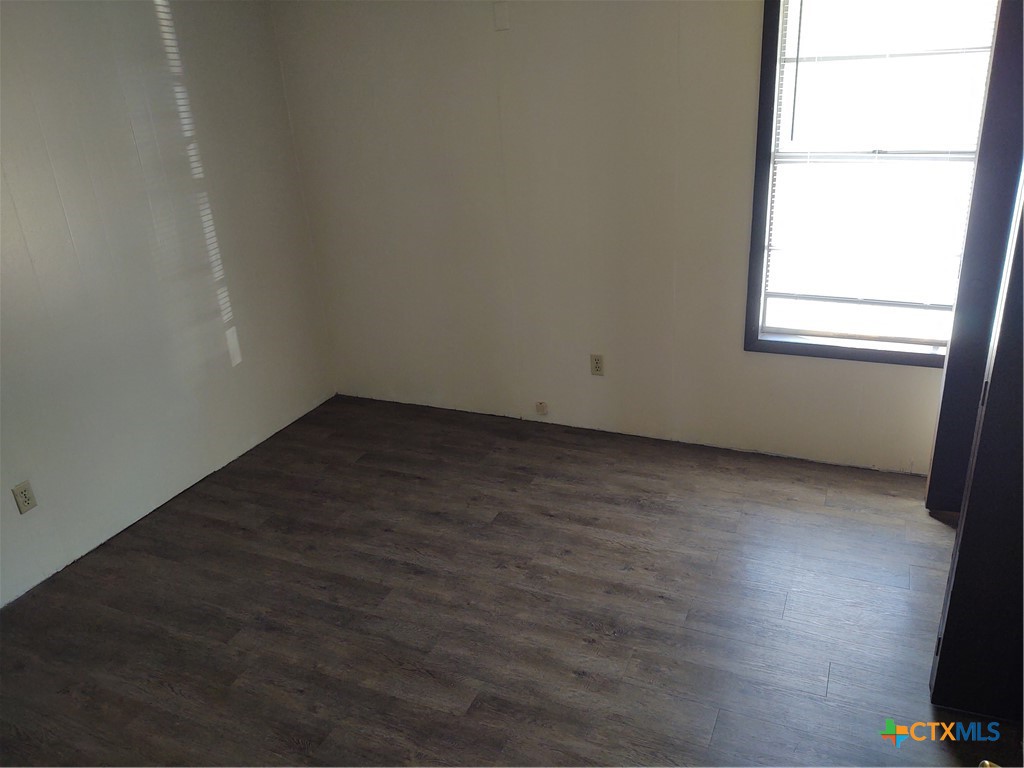 200-220 Quail Run Road Martindale, TX 78655 - Photo 5 of 16 an empty room with a window