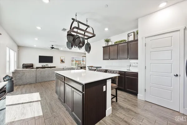 a kitchen with a sink cabinets and stainless steel appliances