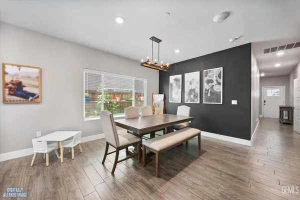 a living room with furniture a window and a chandelier