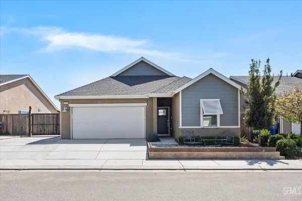 front view of a house with a small yard