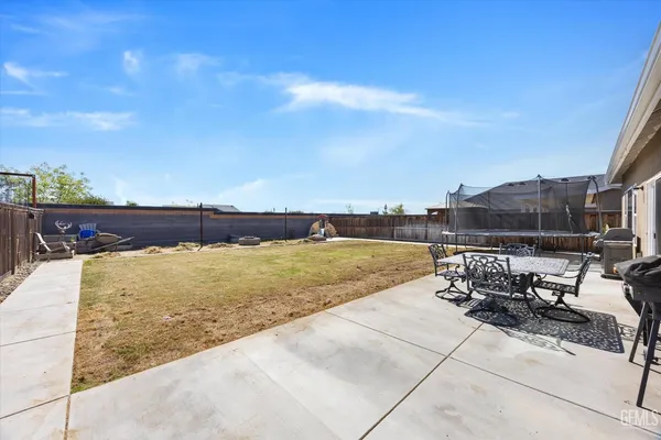 a view of swimming pool with seating space
