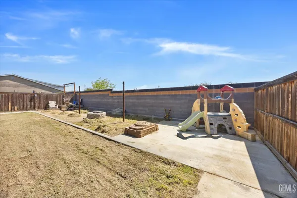 a view of a swimming pool with a lounge chair