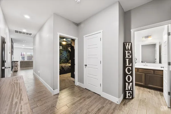 wooden floor in an empty room and a kitchen