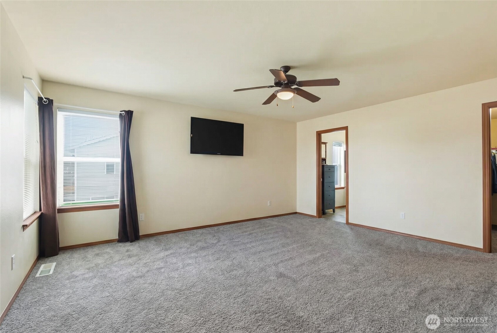 14839 99th Way Southeast Yelm, WA 98597 - Photo 14 of 31 a view of empty room with windows and ceiling fan