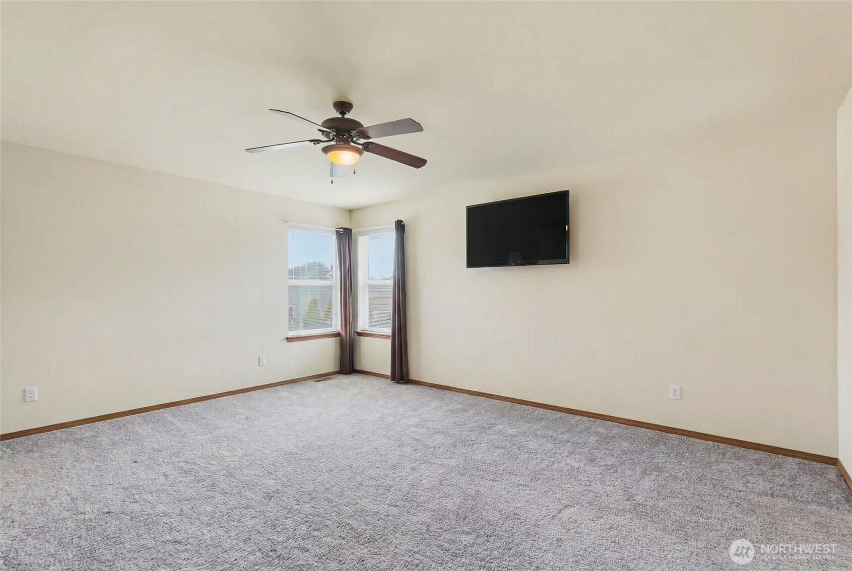 14839 99th Way Southeast Yelm, WA 98597 - Photo 16 of 31 an empty room with windows and fan