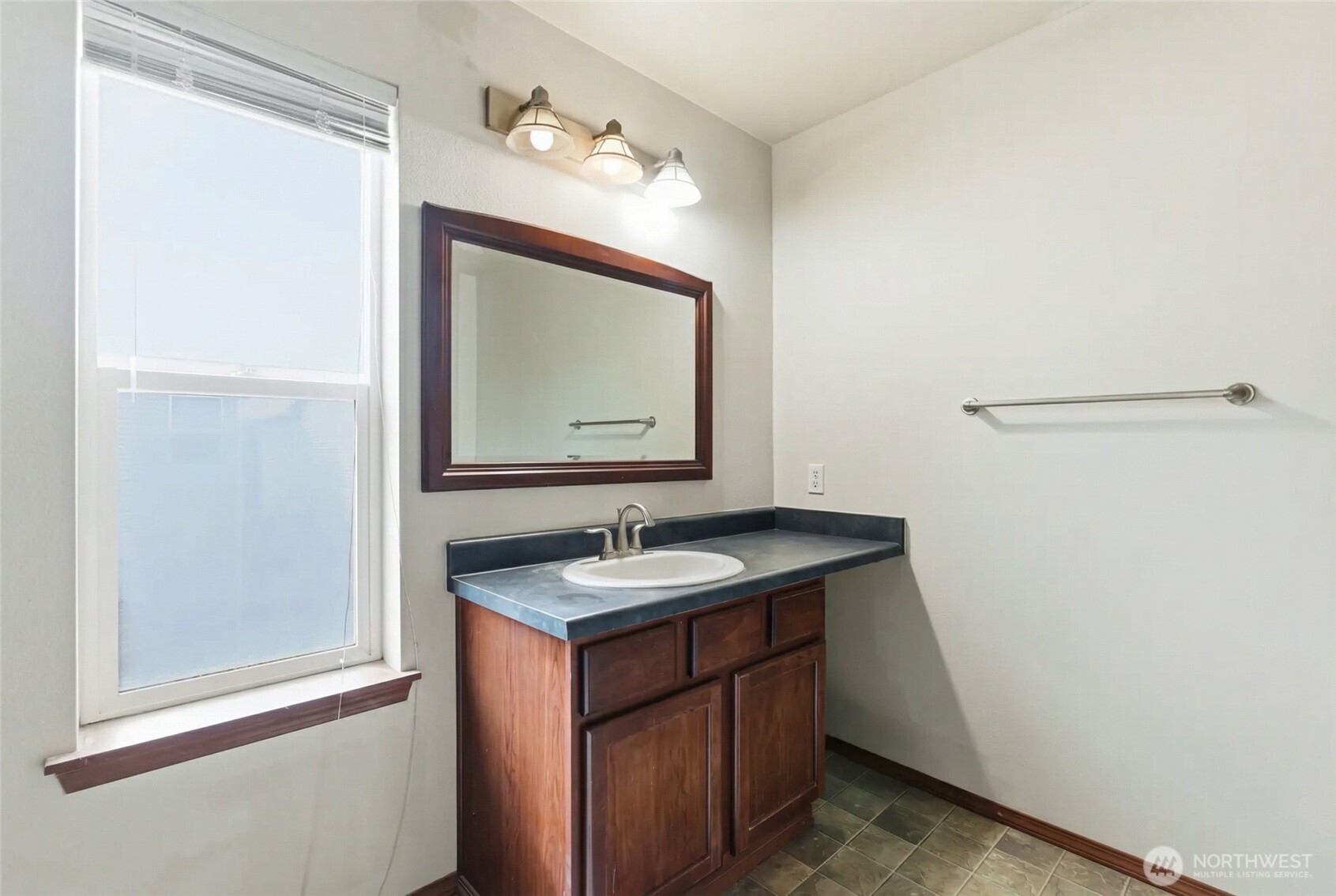 14839 99th Way Southeast Yelm, WA 98597 - Photo 17 of 31 a bathroom with a sink and a mirror