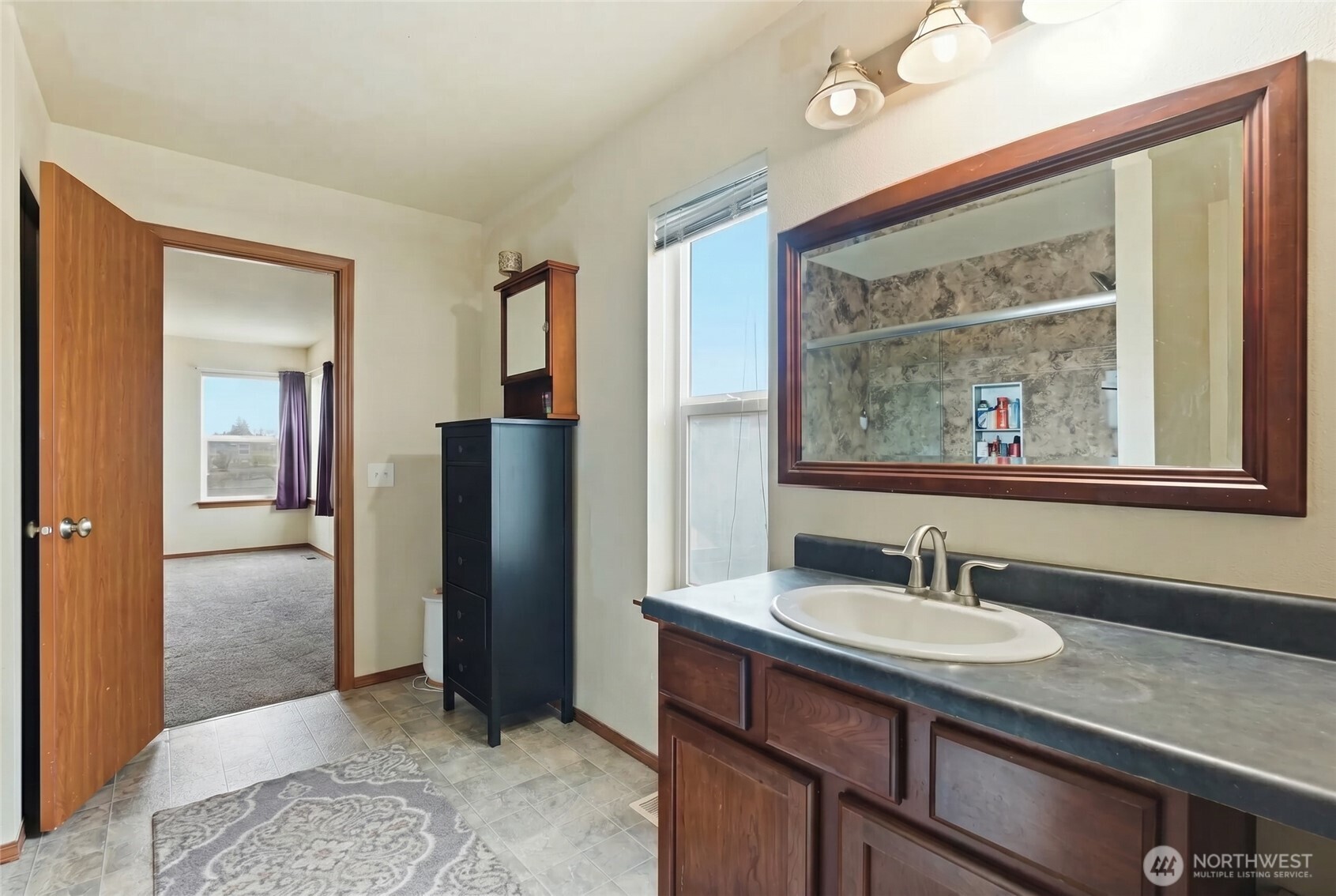 14839 99th Way Southeast Yelm, WA 98597 - Photo 18 of 31 a bathroom with a sink double vanity and a mirror