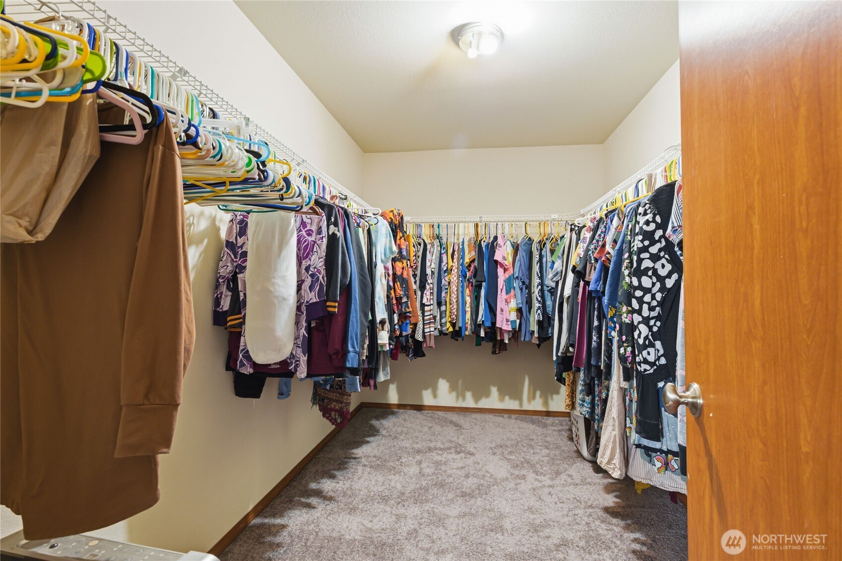 14839 99th Way Southeast Yelm, WA 98597 - Photo 20 of 31 a view of walk in closet with clothes